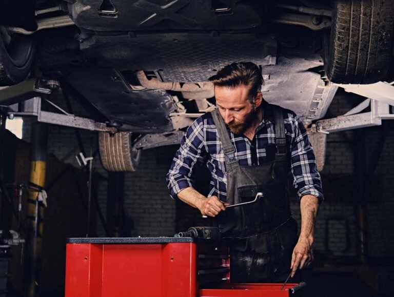 Mechanic choosing tools for fixing a vehicle - Guru Harkishan Motors Delhi
